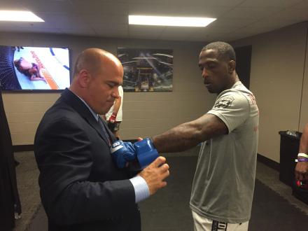 Marlen getting his gloves taped by the commission